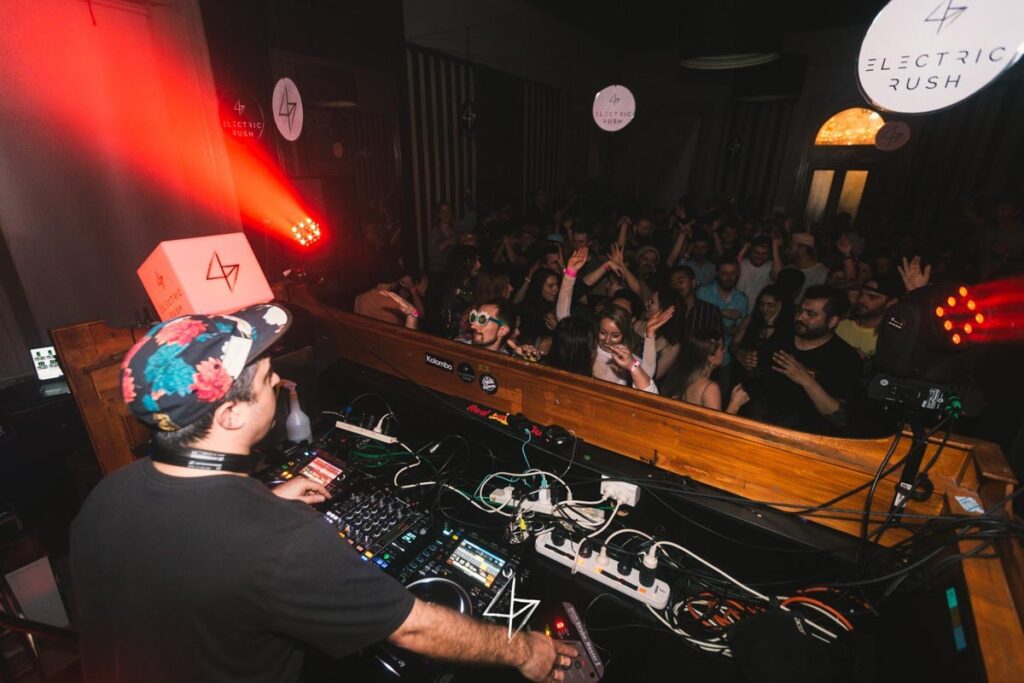 A DJ plays music at 1876 in Queenstown