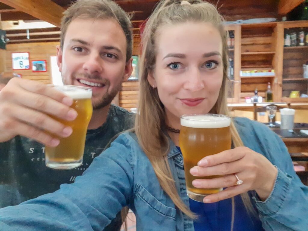 Bailey and her partner take a selfie with beers in Queenstown