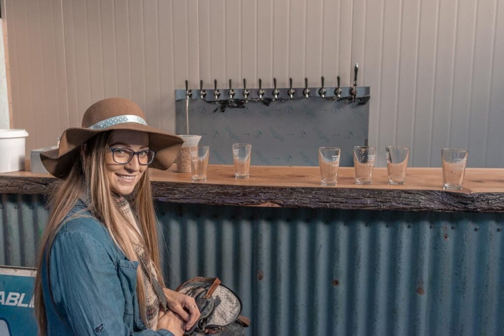 Bailey sits at the bar at Altitude Brewing in Queenstown