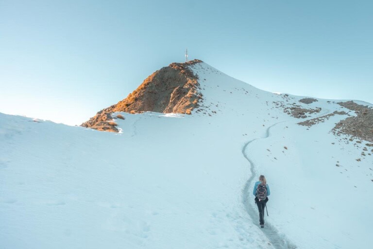 Hiking through the snow to the the real summit of Roy's Peak
