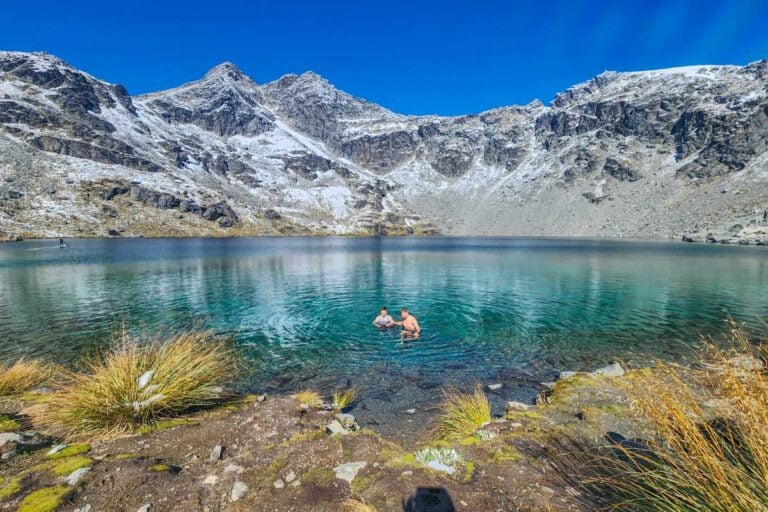 Two people swim in Lake Alta, Queenstown