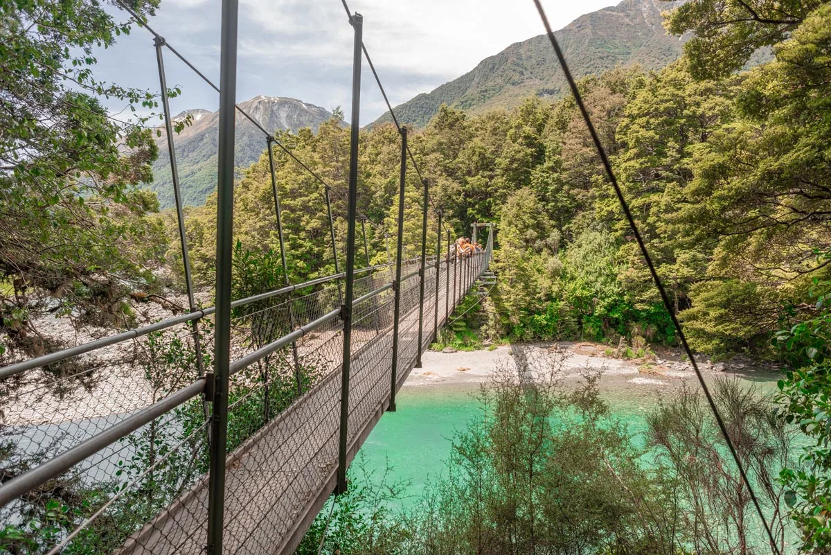 A suspension bridge over the Blue Pools on the west coast of New Zealand's South Island