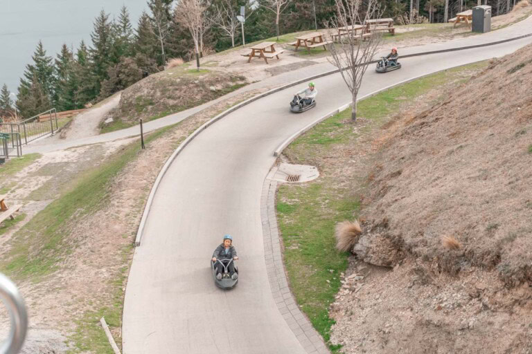 Three people riding the luge in Queenstown