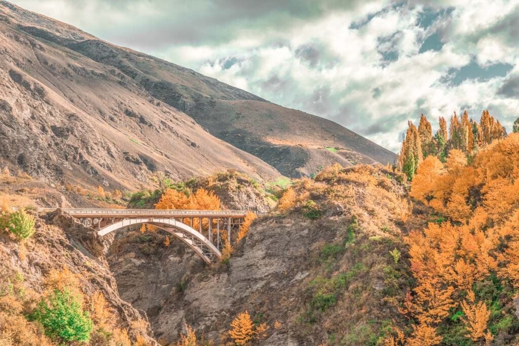 Old Old Lower Shotover bridge and Coronet Peak from bike trail in queenstown