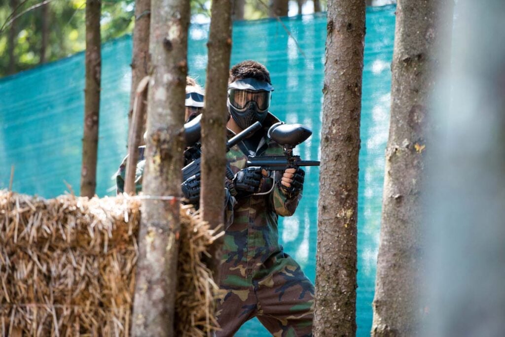 A person plays paintball at Paintball Central