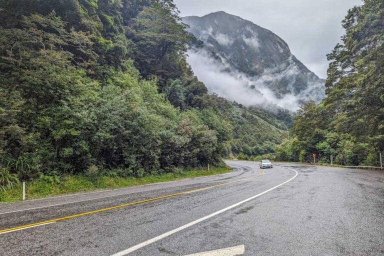 Wet road along the west coast of New Zealand's south island near Franz Josef
