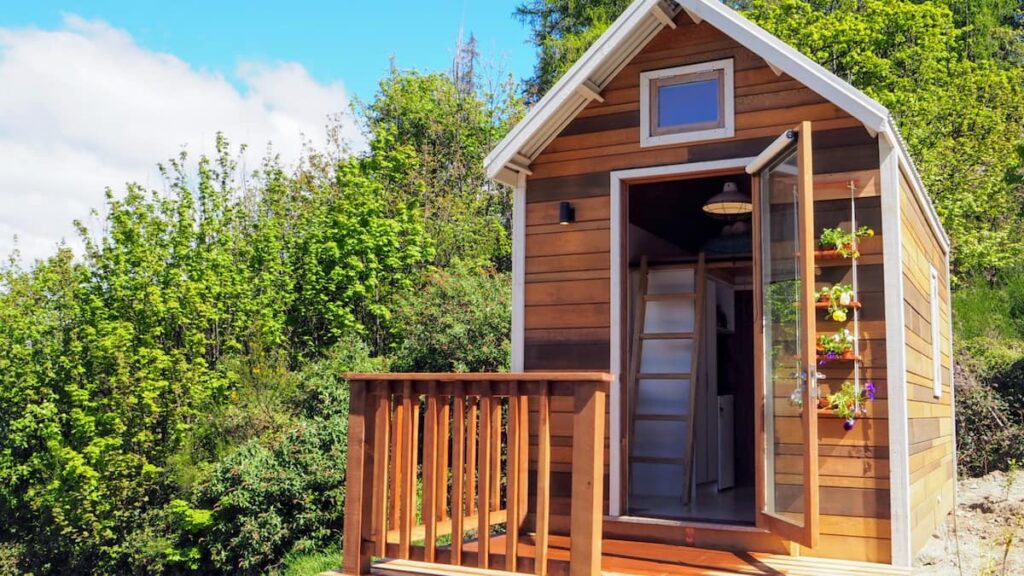 the outside of a tinyhouse that is an airbnb in Queenstown, New Zealand