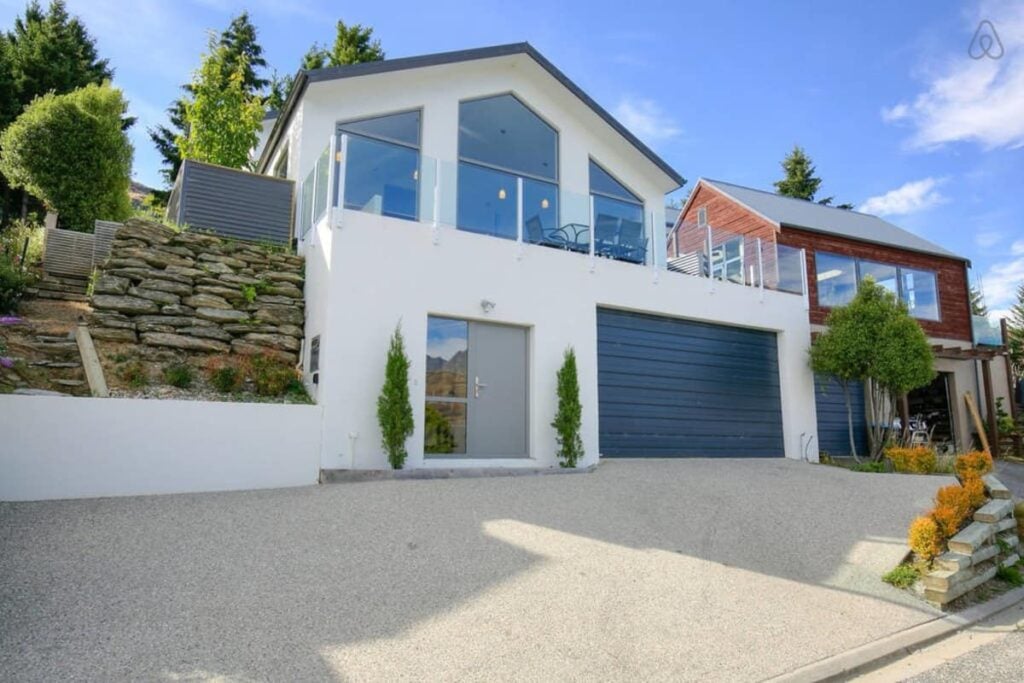 The outside of a large home available on Airbnb in Queenstown, New Zealand