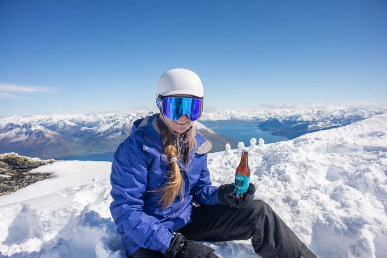 Bailey from My Queenstown Diary enjoys a beer at the top of the Remarkables Ski Area