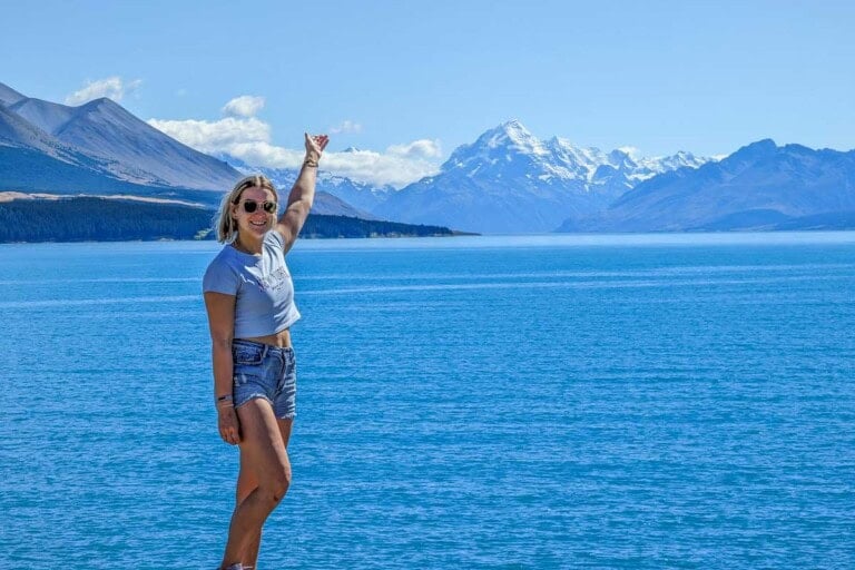 Bailey stands overlooking Mount Cook National Park from one side of Lake Pukaki, New Zealand