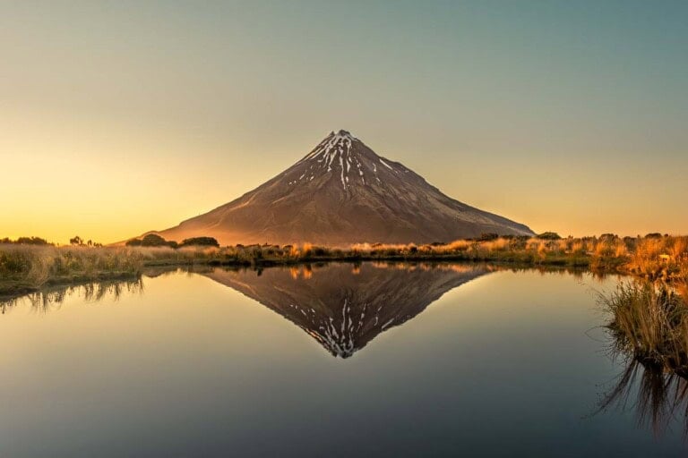 Reflections of Mt Taranaki at the Pouakai Tarn on the Pouakai Circuit