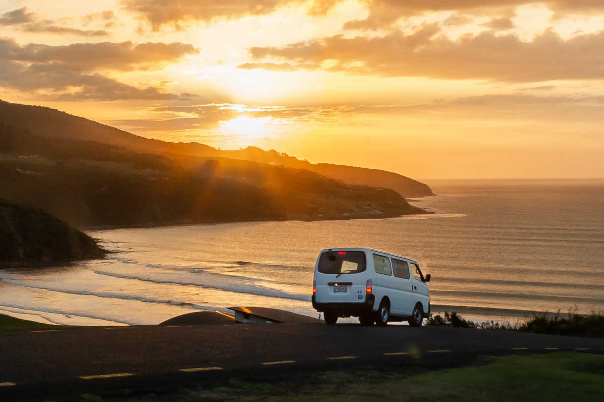Campervan-at-sunset-near-the-beach-in-Raglan