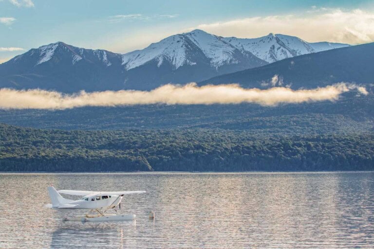 A float plane sits on Lake Te Anau on a beautiful morning