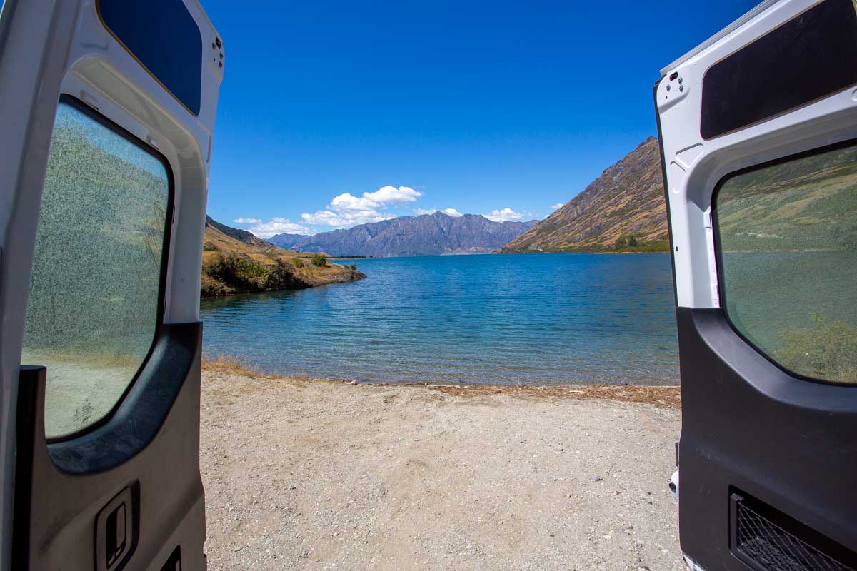 View of Lake Wanaka from a campervan in New Zealand
