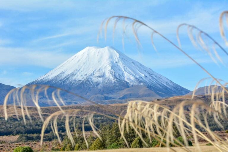 Mount Ngauruhoe covered in snow as seen from the road in Tongariro National Park, New Zealand