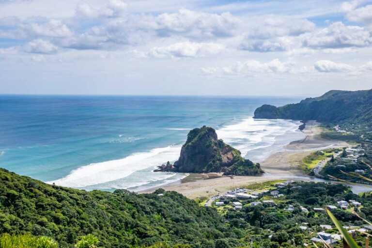View of Piha Beach from the lookout showing the beach and Lion Rock