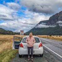 Bailey with her rental car in the Eglinton Valley, NZ