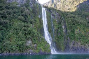 A large waterfall on the milford sound nature cruise new zealand