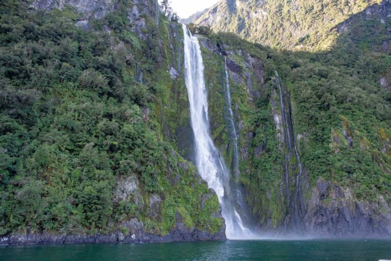 A large waterfall on the milford sound nature cruise new zealand