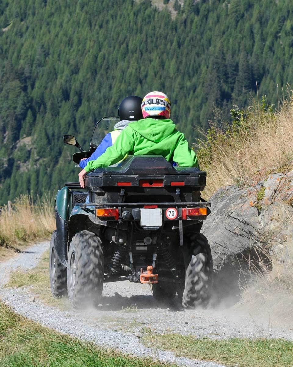 People-ride-an-ATV-near Quenstown-New-Zealand