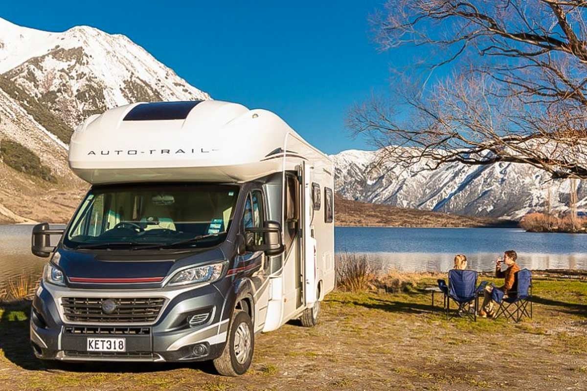 a kiwi motorhomes rv camping by the lake
