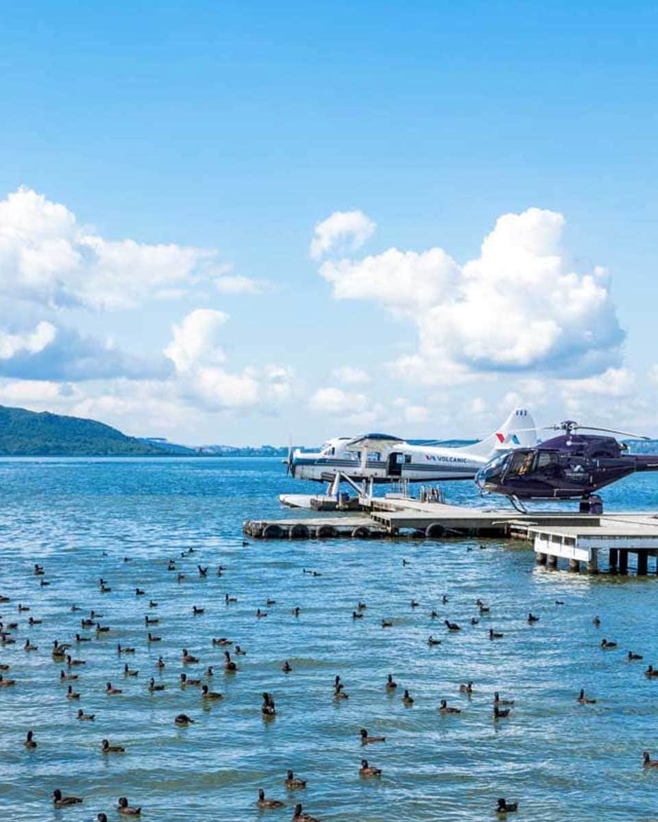 A-helicopter-sits-on-a-helipad-on-Lake-Rotorua-New-Zealand