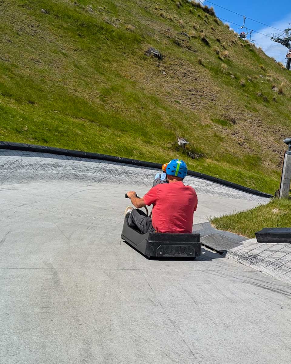 A person going on a luge ride in New Zealand