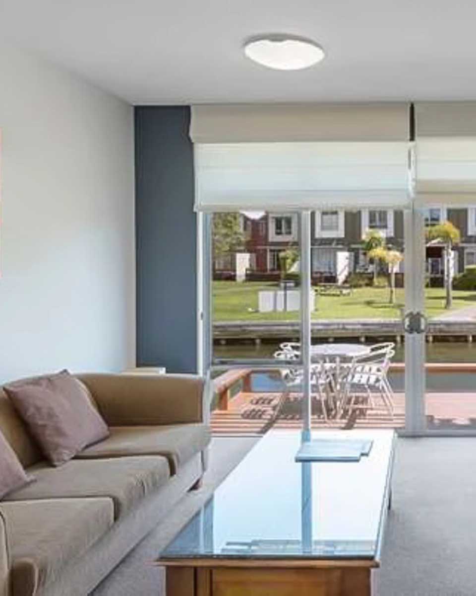 Living room area of a hotel room at Ramada Resort by Wyndham Rotorua Marama copy