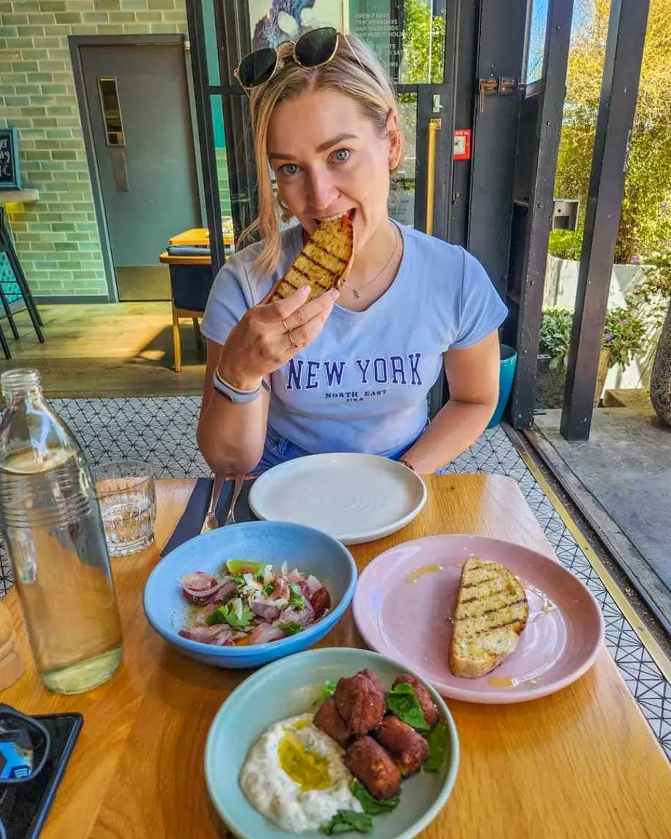 Bailey eats at a cafe in Dunedin, New Zealand